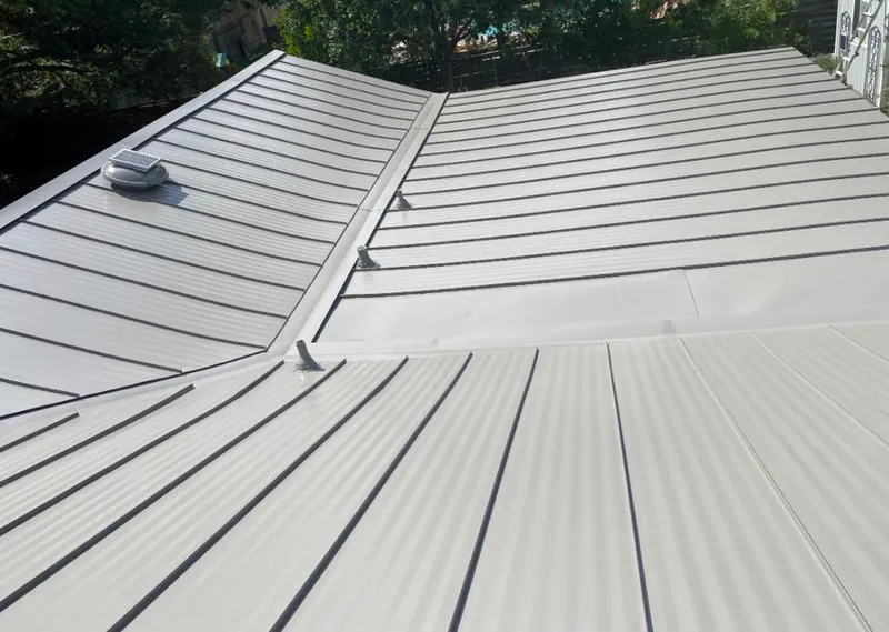 Solar attic fan installed on a metal roof for Roof Ventilation in Wrightsboro